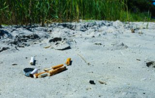 Cigarettes and litter on beach
